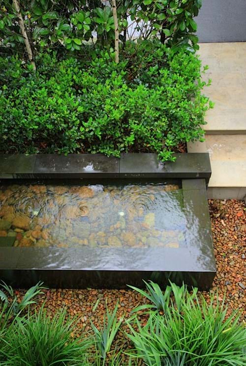 Spillover water feature with bluestone